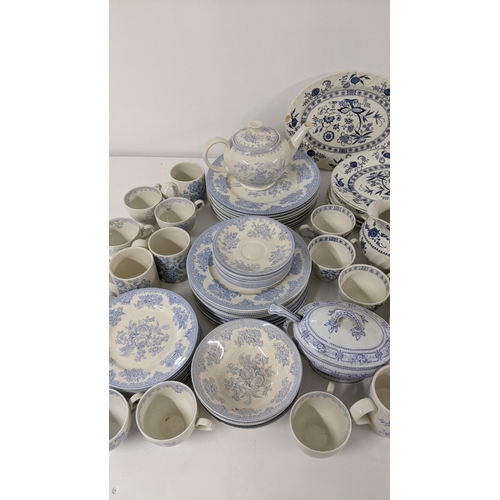 254 - A large collection of blue and white teal dinner services, to include Johnson brothers service and o... 