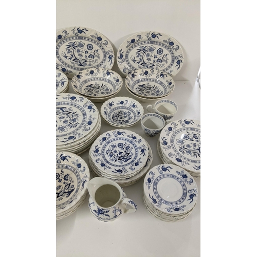 254 - A large collection of blue and white teal dinner services, to include Johnson brothers service and o... 