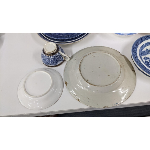 255 - Mixed blue and white porcelain to include an 18th century faience plate, Royal Lily pattern cup with... 