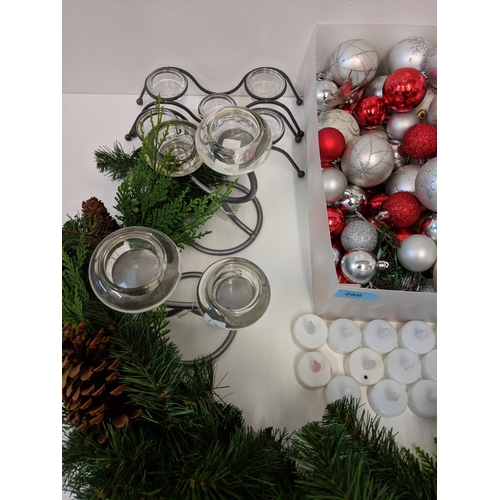 266 - Christmas decorations to include baubles, candles, candlesticks, wreath and other items
Location:2.4