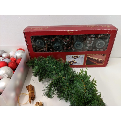 266 - Christmas decorations to include baubles, candles, candlesticks, wreath and other items
Location:2.4