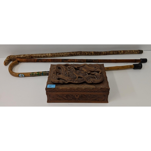 267 - A wood jewellery box carved with a dragon, a Japanese carved bamboo walking stick and others
Locatio... 