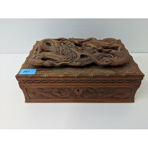 267 - A wood jewellery box carved with a dragon, a Japanese carved bamboo walking stick and others
Locatio... 