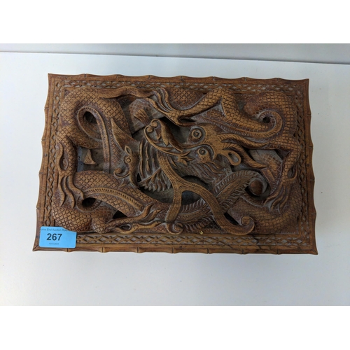 267 - A wood jewellery box carved with a dragon, a Japanese carved bamboo walking stick and others
Locatio... 