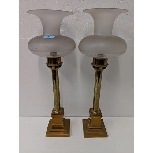 269 - A pair of brass candlesticks lamps with etched glass shades.
Location:A1F