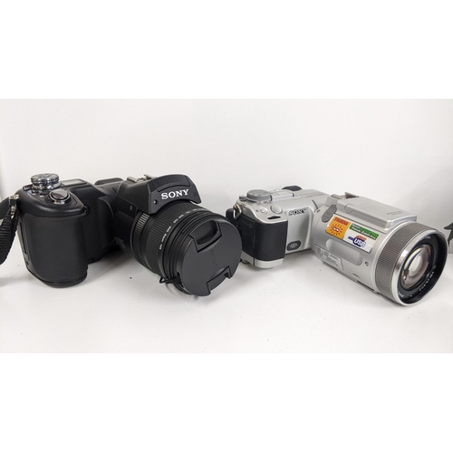 317 - A Sony DSC - F828 digital camera together with a Sony DSC F717 camera with a Carl Zeiss Vario Scanne... 