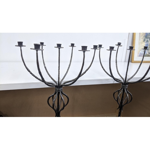 319 - A pair of wrought iron seven branch floor standing candlesticks, 128h
Location:ROS/A1F