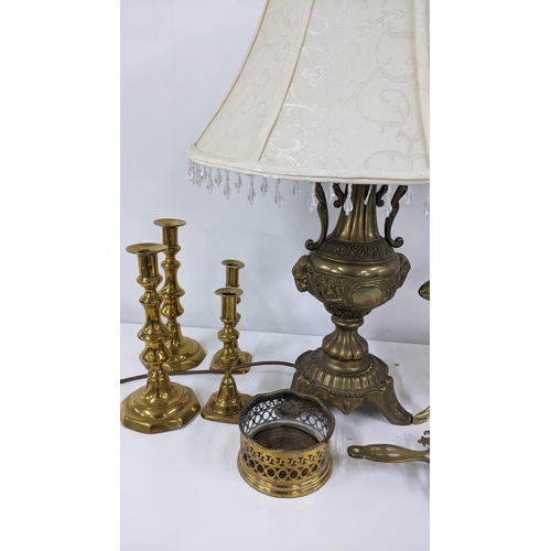 326 - Mixed brassware to include a cast Grecian style twin handled table lamp, goffering iron and other it... 