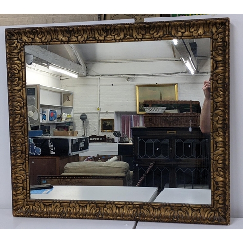 330 - An early 20th century gilt framed wall mirror having sausage and pea decoration and moulded frame
Lo... 