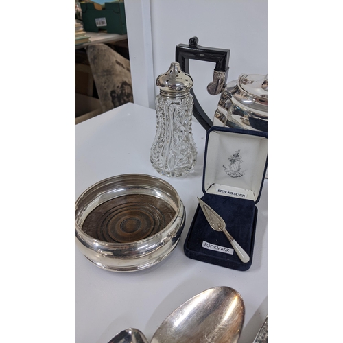 345 - Mixed silver plate to include a tea set, toast rack, cutlery etc. together with a silver coaster, si... 