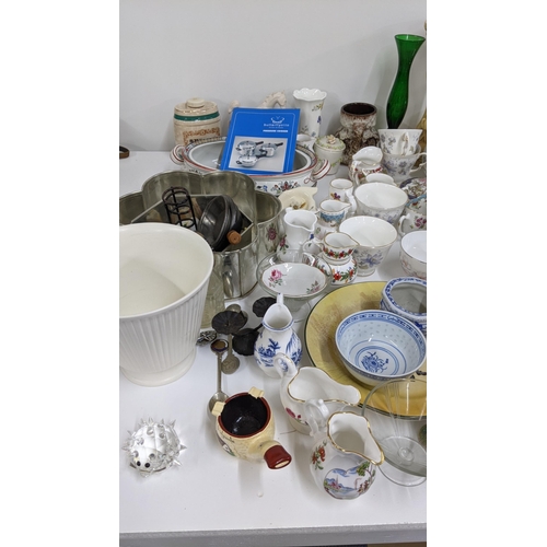 349 - A mixed lot to include pressure cooker baking tins, mixed ceramics, a Swarovski crystal hedgehog A/F... 