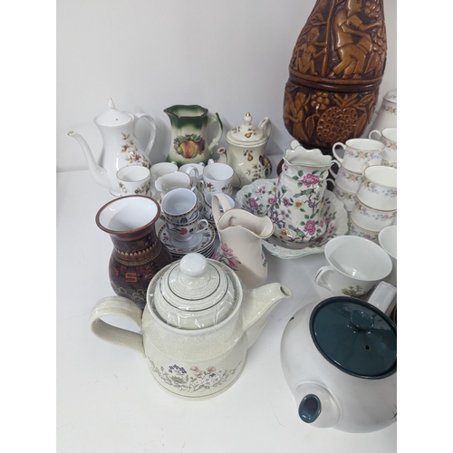 353 - Mixed ceramics to include royal Doulton, Poole pottery, Staffordshire, Beswick and others, vases, te... 