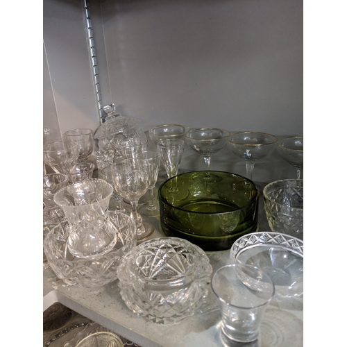 50 - A large quantity of glassware to include domestic glasses, bowls, decanters and other items
Location... 