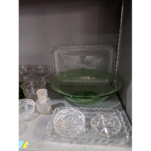 50 - A large quantity of glassware to include domestic glasses, bowls, decanters and other items
Location... 