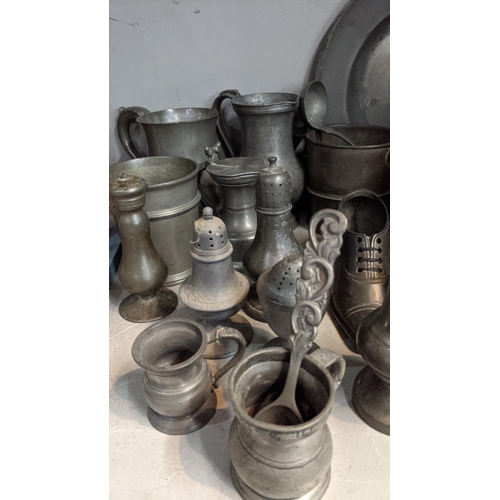 70 - 18th century and later pewter items to include a meat cover, tankards, salt and pepper shakers and o... 