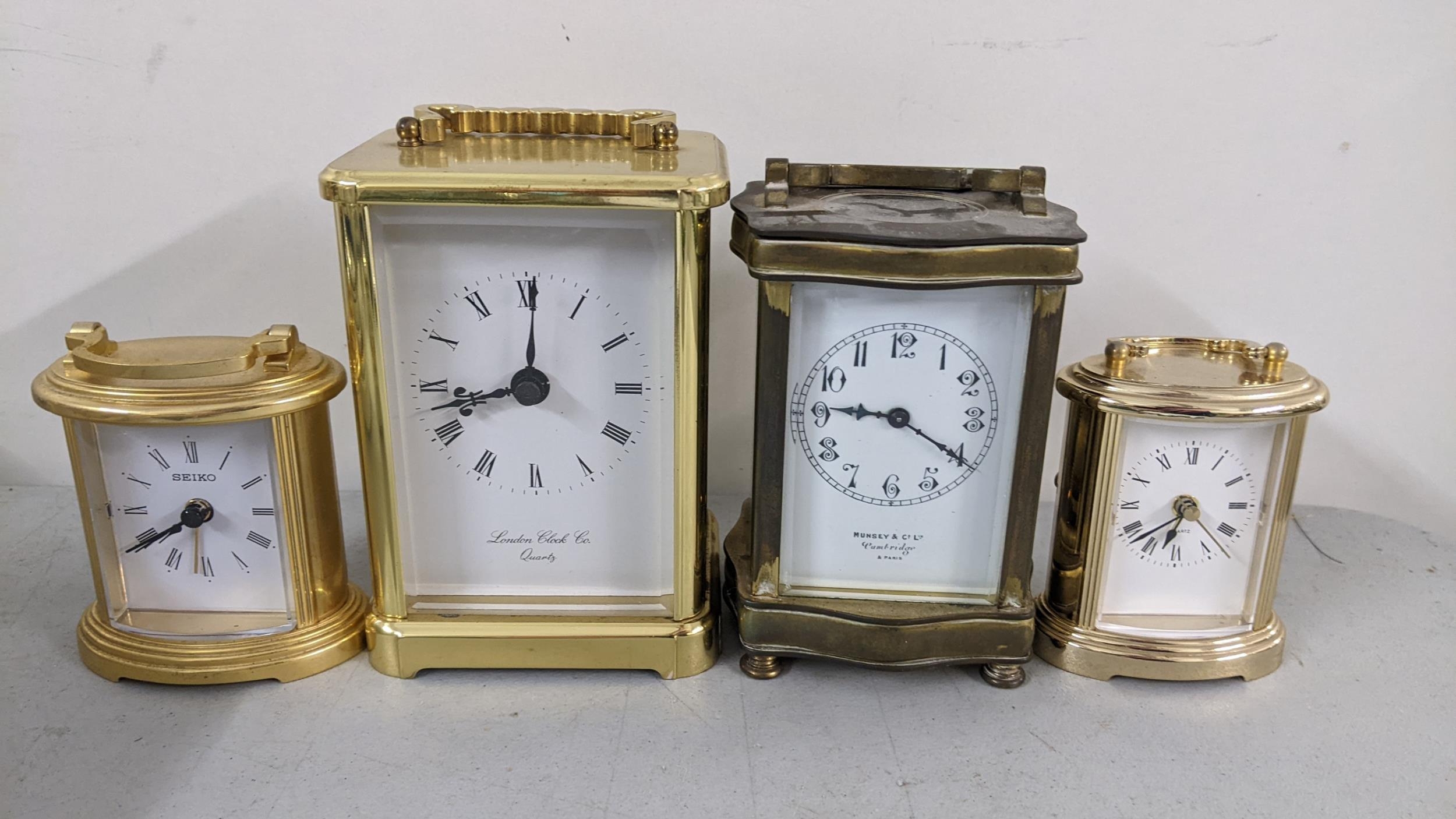 Four carriage clocks to include an Edwardian clock with platform ...