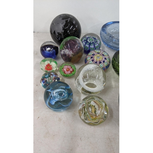 79 - A group of paperweights to include Caithness paperweights and others along with Whitefriars glass bo... 