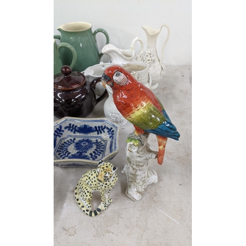 82 - A mixed lot to include Denby teapots, jugs and others, a Capodimonte parrot, Wedgwood jasperware vas... 