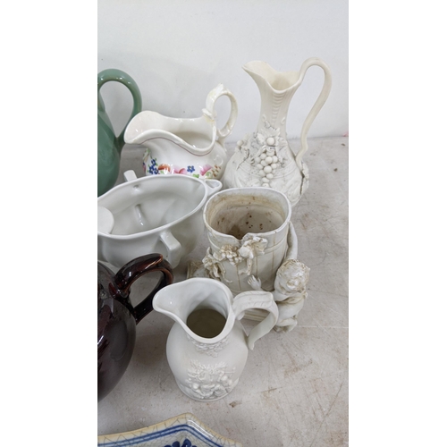 82 - A mixed lot to include Denby teapots, jugs and others, a Capodimonte parrot, Wedgwood jasperware vas... 