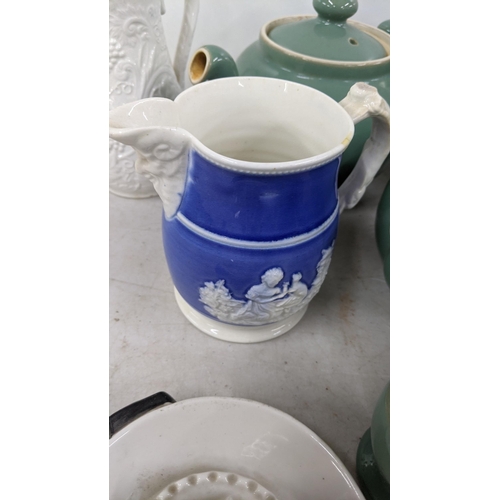 82 - A mixed lot to include Denby teapots, jugs and others, a Capodimonte parrot, Wedgwood jasperware vas... 