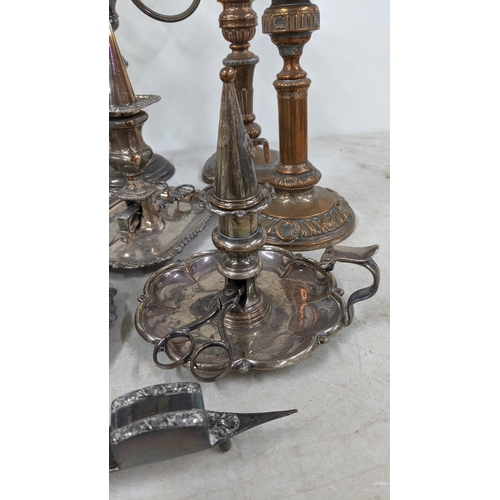 83 - A three branch candelabra, silver on copper plated together with a pair of candlestick holders along... 