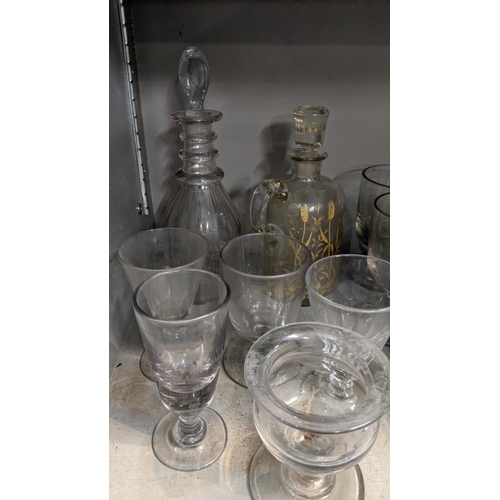 87 - Glassware to include two decanters including a Georgian example together with 19th century and later... 