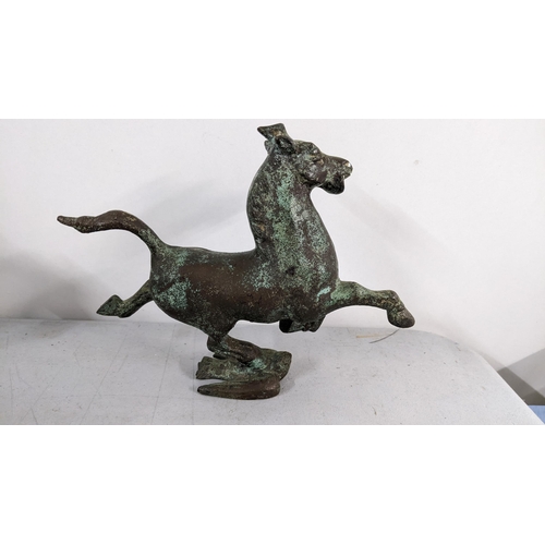 91 - A Chinese bronze ornament flying horse of Gansu, modelled upon a flying swallow
Location:2.1