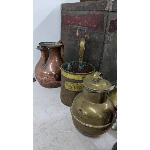 95 - A mixed lot of metalware to include brass candlesticks, a copper jug, a Spanish pewter tray and othe... 