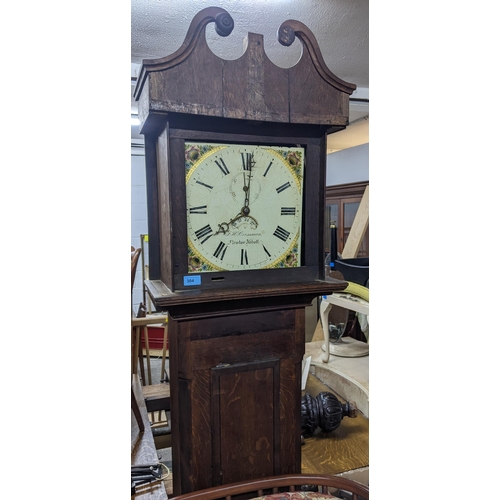 304 - A F.H Crossman Newton Abbot, an oak cased longcase clock off white painted face with roman numerals ... 