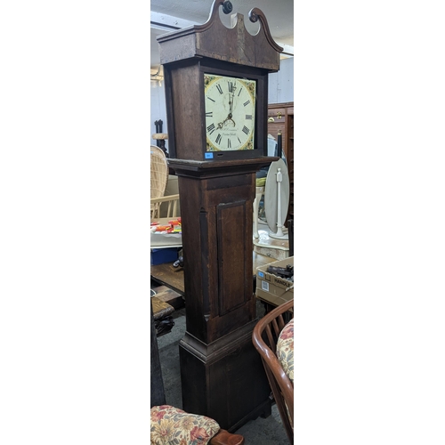 304 - A F.H Crossman Newton Abbot, an oak cased longcase clock off white painted face with roman numerals ... 