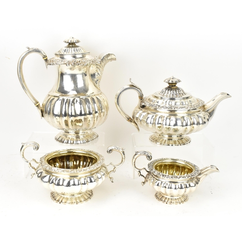 A George IV silver three piece tea service, with near matching silver coffee pot, the tea set by William Brown, London 1826, the coffee pot with partly rubbed marks, both pots with ivory spacers to the handles, all four pieces designed with ribbed bombe body, scrolled acanthus and rocaille moulded rim, the sugar bowl with scroll twin-handles, on moulded foot, the coffee pot 24.5 cm high, total weight 2379 grams
Ivory Declaration reference for teapot: KDY7KQFB
Ivory Declaration reference for coffee pot: J3XC4G3G