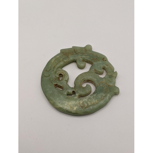 429 - A jade double sided carved disc fashioned as a dragon, Location:CAB6