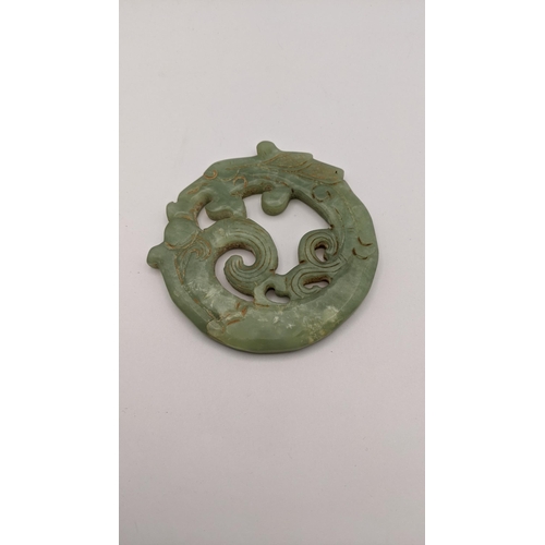 429 - A jade double sided carved disc fashioned as a dragon, Location:CAB6