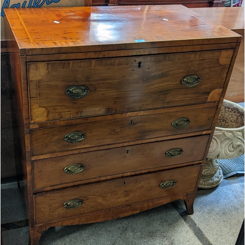 373 - A George III mahogany secretaire chest having a fitted interior above three drawers and boxwood inla... 