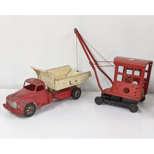 383 - A mid 20th century Buddy Hydraulic dump truck, along with a crane, together with two tin storage box... 