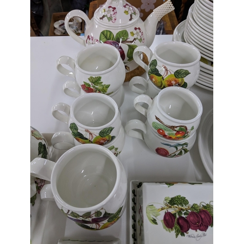 407 - Portmeirion dinner and teaware to include Pomona pattern teapot, cups, plates, butter and other dish... 