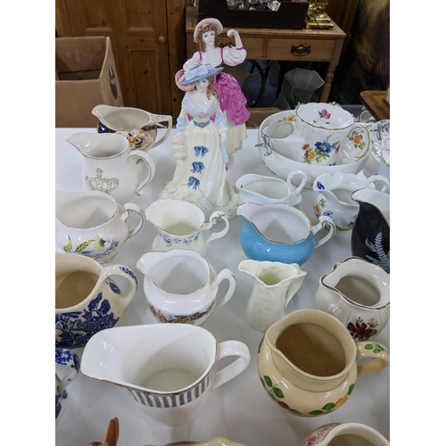 408 - A collection of approx. fifty milk and cream jugs to include Aynsley, Royal Albert and Aynsley Cotta... 