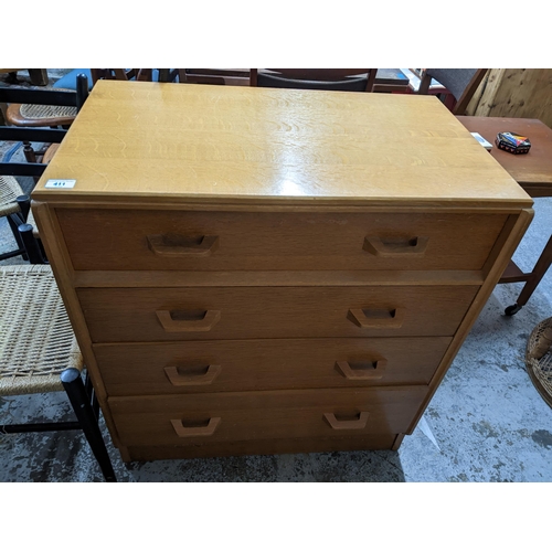 411 - A lightwood chest of four drawers, a teak card table with fold over swivel top, square tapering legs... 