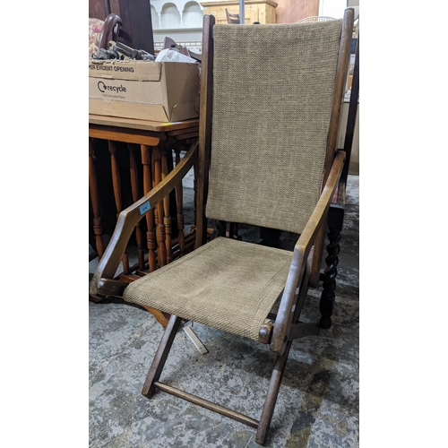 414 - A wooden framed colonial campaign style folding chair
Location:G