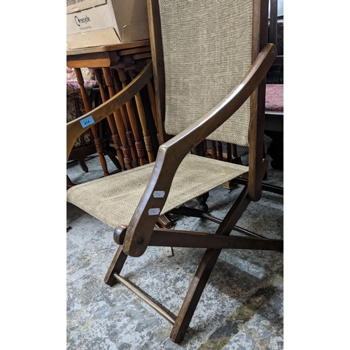 414 - A wooden framed colonial campaign style folding chair
Location:G