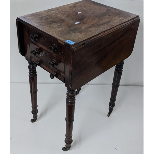 418 - An early 19th century mahogany work table having two fall flaps and turned legs, 73cm x 51cm w
Locat... 