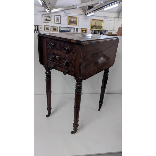 418 - An early 19th century mahogany work table having two fall flaps and turned legs, 73cm x 51cm w
Locat... 