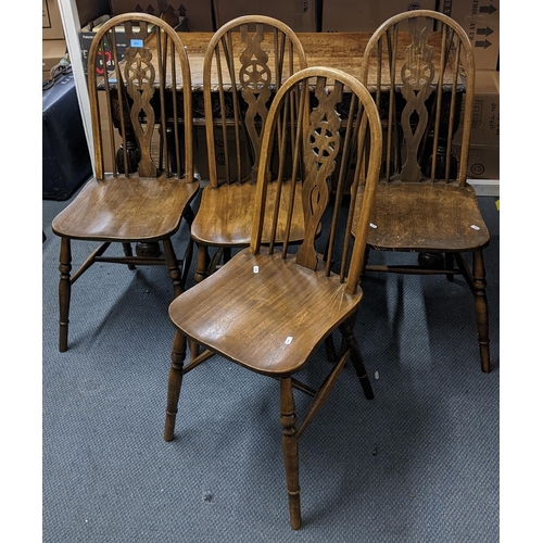 421 - A set of four mid 20th century stained beech hoop spindle back dining chairs
Location:SL