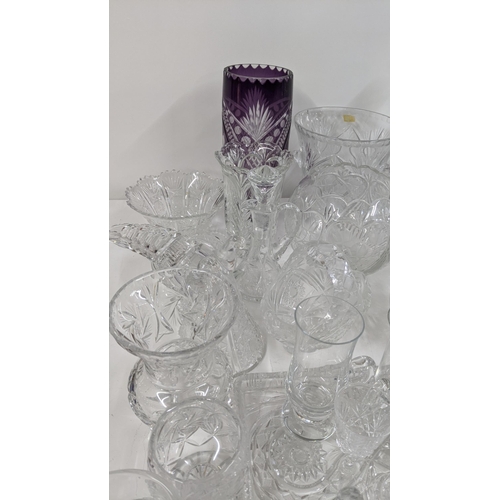 436 - A mixed lot of glassware to include mostly crystal cut glass to include various drinking glasses, va... 