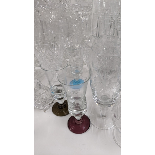 436 - A mixed lot of glassware to include mostly crystal cut glass to include various drinking glasses, va... 