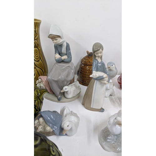 A mixed lot to include Lladro figurines together with porcelain models of  birds and other items Loca