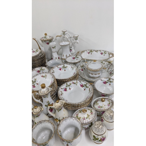 443 - A part dinner/tea service having a floral design on a white background and gilt edges Location:A1M