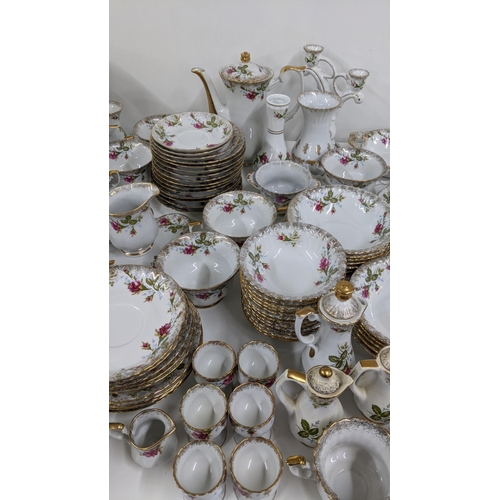 443 - A part dinner/tea service having a floral design on a white background and gilt edges Location:A1M