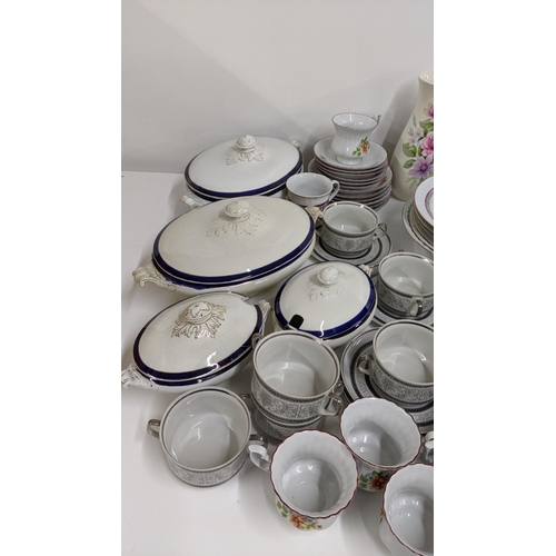 444 - A mixed ceramics to include a dinner/tea service along with a part dinner service having a floral de... 