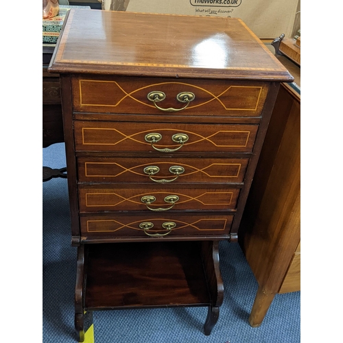 460 - An Edwardian mahogany and boxwood four drawer music cabinet with open shelf below and a hinged top, ... 